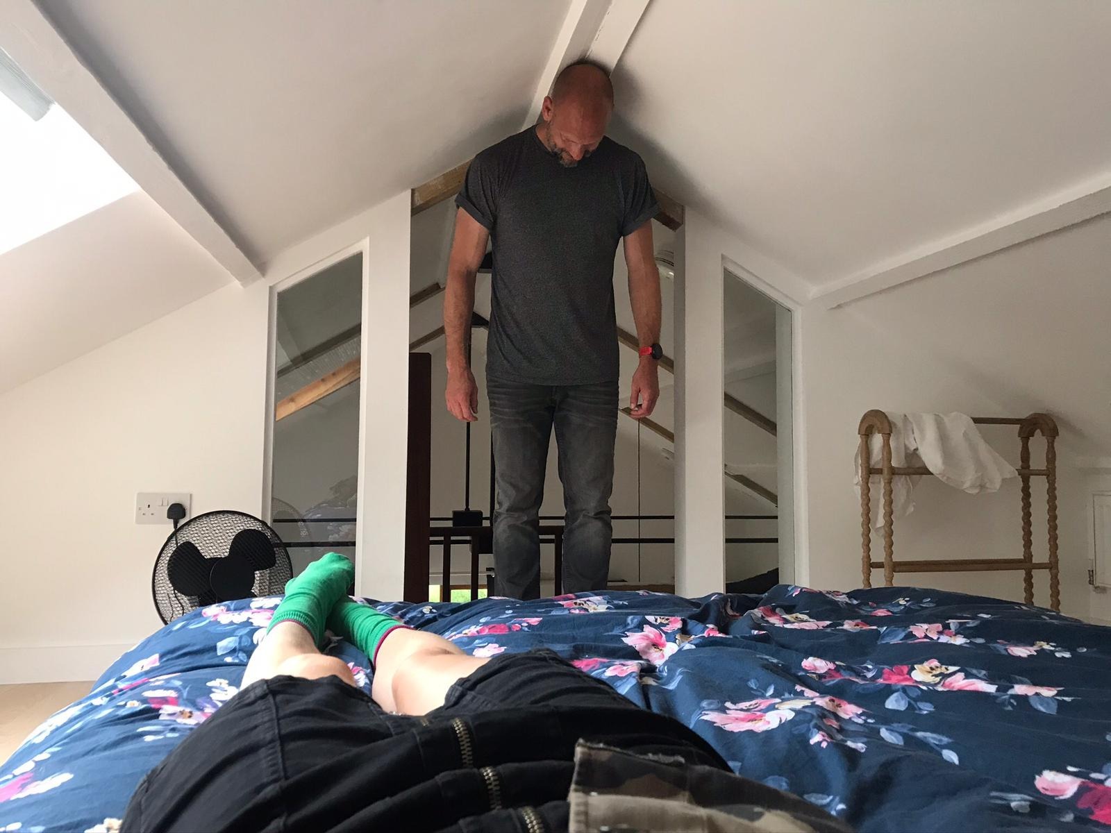 Richard Jason Smith Standing in Bedroom